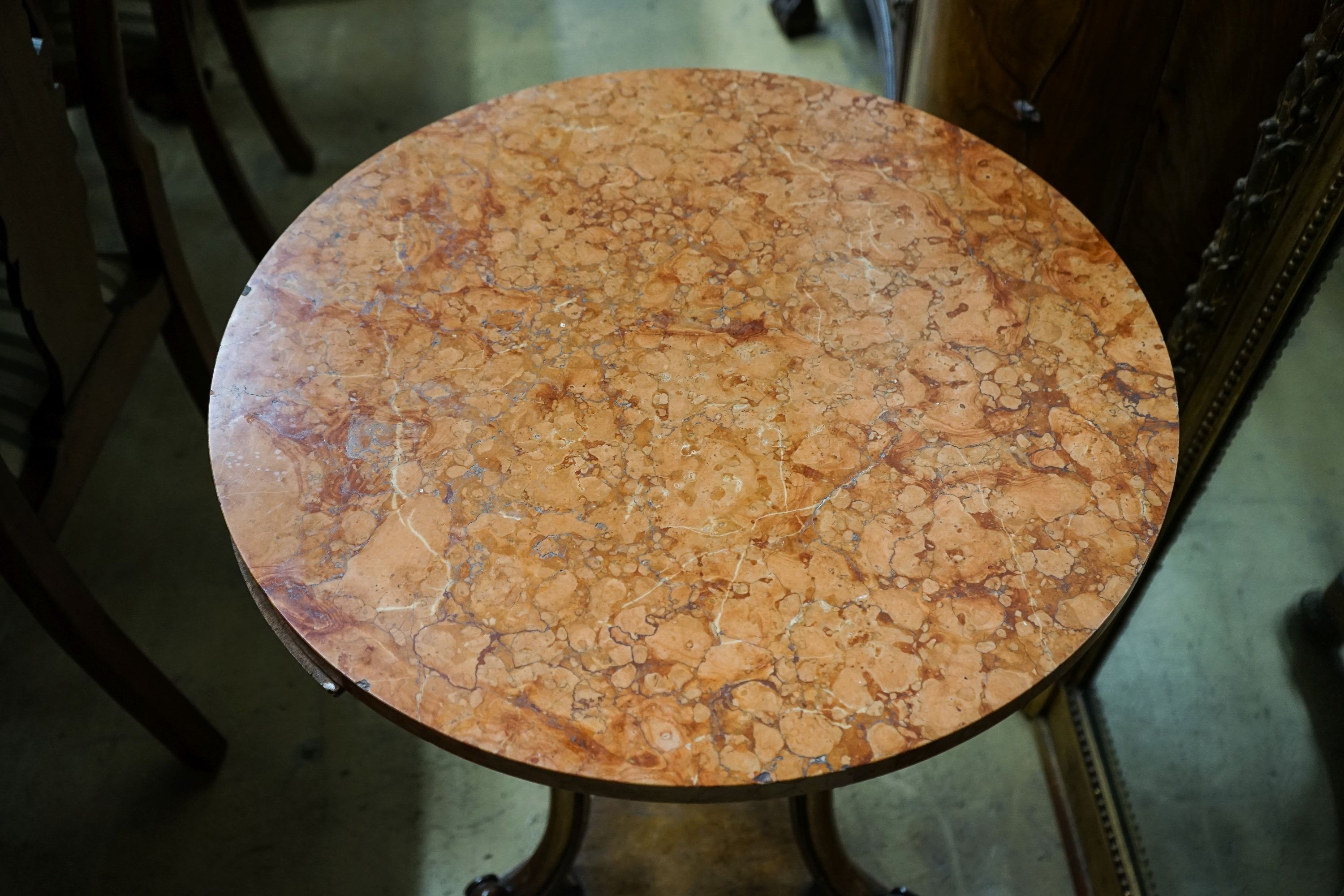 A Victorian gilt metal mounted walnut circular marble top table, diameter 60cm, height 73cm